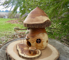Hand turned fairy house with kinetic swing and tiny dinette designed and created by Schoolhouse Woodcrafts