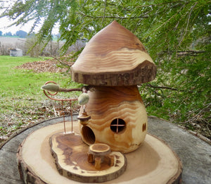 Hand turned fairy house with kinetic swing and tiny dinette designed and created by Schoolhouse Woodcrafts