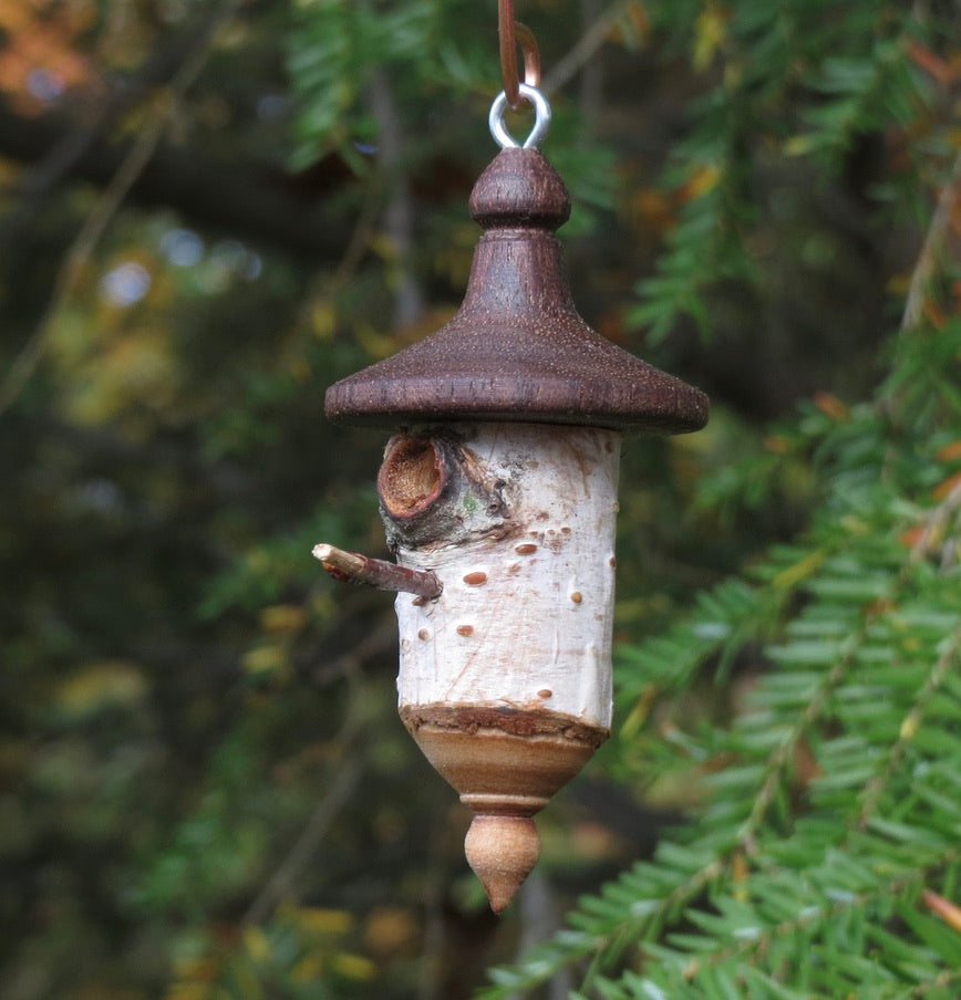 Hand turned birch and walnut birdhouse ornament, designed and created by Schoolhouse Woodcrafts