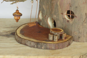 close up of swing & dinette on fairy house